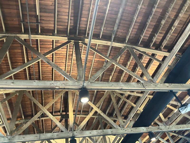 Up lighting shows off the beautiful roof structure of the Loft at 66 air B&B and event center. #lab2024