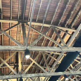 Up lighting shows off the beautiful roof structure of the Loft at 66 air B&B and event center. #lab2024