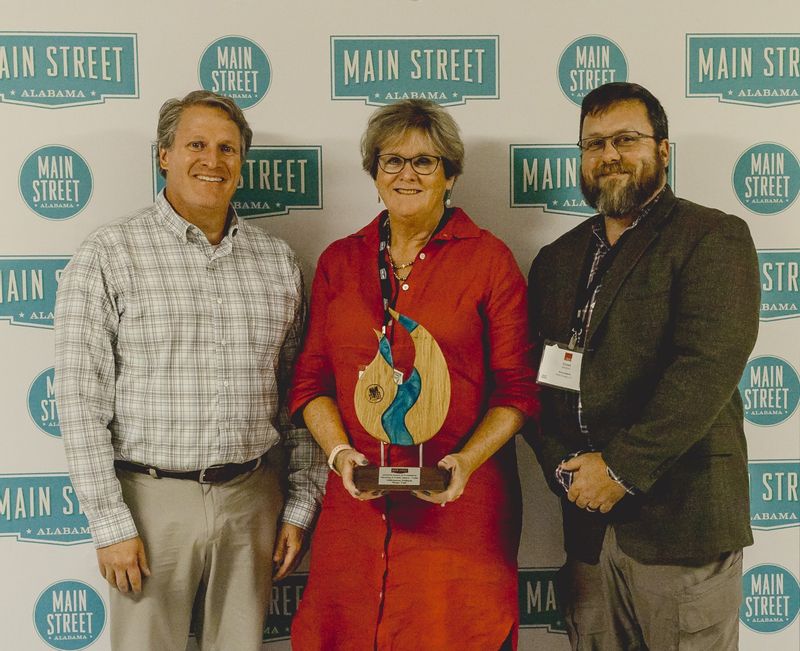 The City of Foley won the 2023-2024 Award of Excellence Planning & Public Space for the completion of the Wilbourne Rose Trail. Pictured: City of Foley Executive Director of Infrastructure and  Development Wayne Dyess,  Foley Main Street Director Darrelyn Dunmore and Foley Main Street President Chad Watkins.