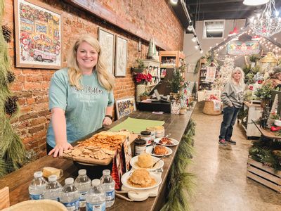 Anna Phillips offers customers samples in her historic shop in downtown Fayetteville, TN