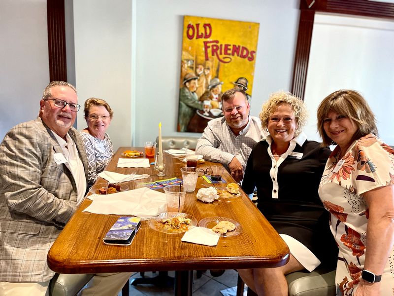 Enjoying quality networking time at the Foley Main Street October meetin. Mayor & Jo  Hellmich; Michael and Michelle McConnell and Connie Robertson. 