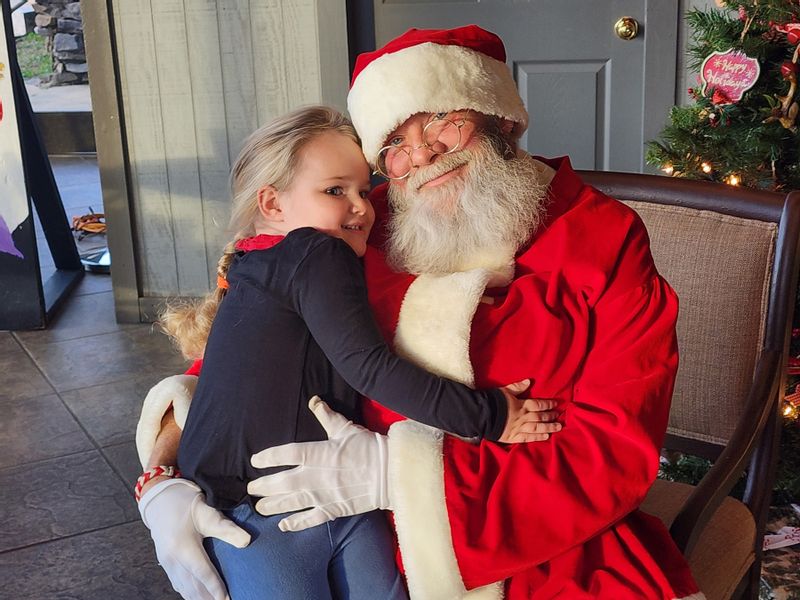 Little girl visiting Santa at Cheaha State Park Little girl visiting Santa at Cheaha State Park