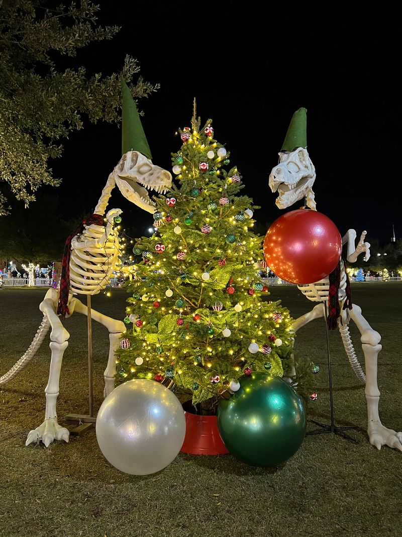 Tuscaloosa Christmas tree display, with dinosaurs, at the Tinsel Trail event