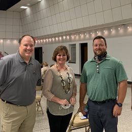 Board members Todd Koniar, Frances Holk-Jones, Chad Watkins with property owner Mark Wright at the unveiling of the Downtown Foley and Foley Main Street branding 2020