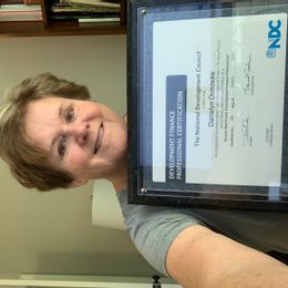 Executive Director Foley Main Street receiving certification COVID style 