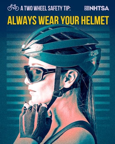 A person wearing a bicycle helmet and sunglasses is shown in profile, adjusting the helmet strap under their chin. The image includes bold text that reads, “A Two Wheel Safety Tip: Always Wear Your Helmet,” along with the NHTSA (National Highway Traffic Safety Administration) logo. The background features a stylized blue and teal design, emphasizing the importance of helmet use for bicycle safety.