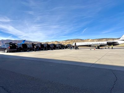 Blue Sky Limo SUVs staged for a group arrival on the Eagle County Regional Airport ramp