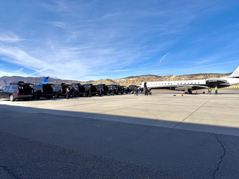 Blue Sky Limo SUVs staged for a group arrival on the Eagle County Regional Airport ramp