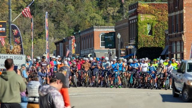 Hundreds of cyclists line in downtown Lanesboro, MN of at the start of the Filthy 50 gravel bike race