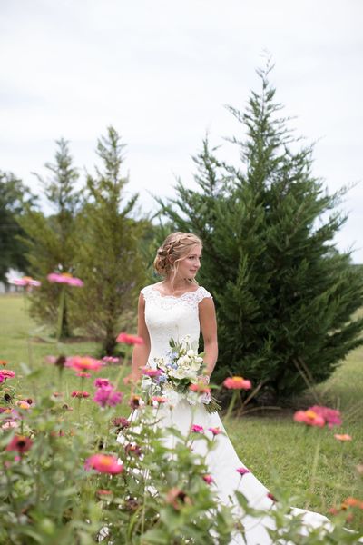 Bride with wildflower scenery and cedar trees