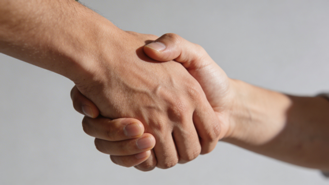 Close up of two hands shaking