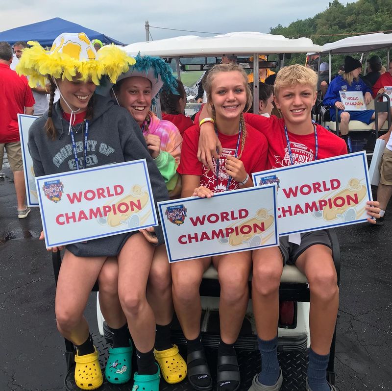 Aidyn Driggers (2nd from right) & Cash Driggers (pictured on right) in the World Champion Parade at 2021 All-American Soap Box Derby at Derby Downs in Akron Ohio.