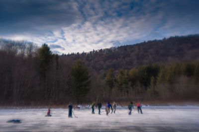 Playing hockey on the ice pond