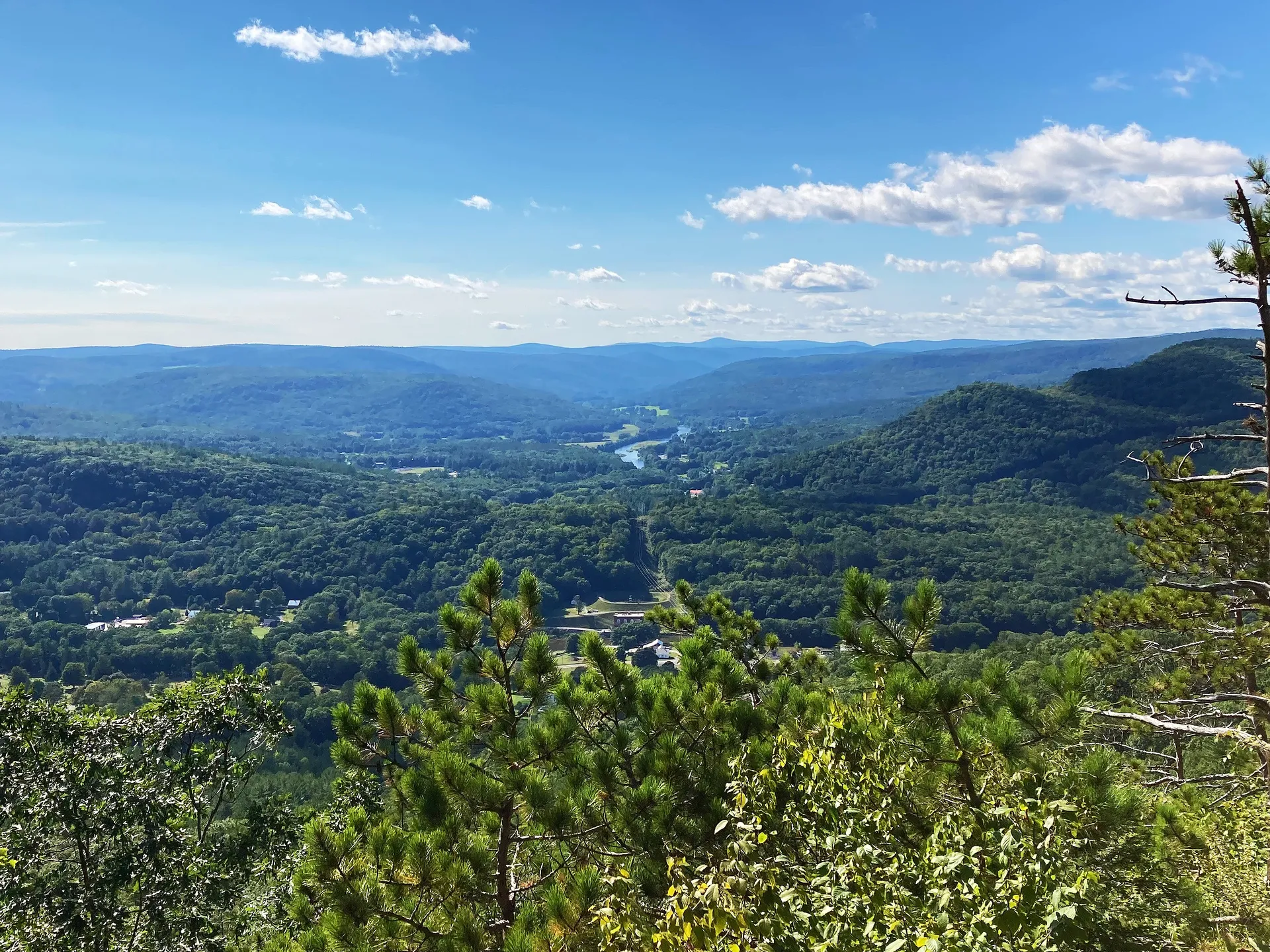view of a valley with mountains in the distance