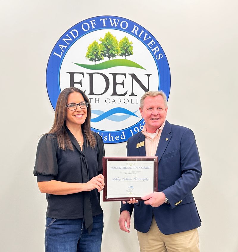 Ashley Latham accepting her award with Randy Hunt