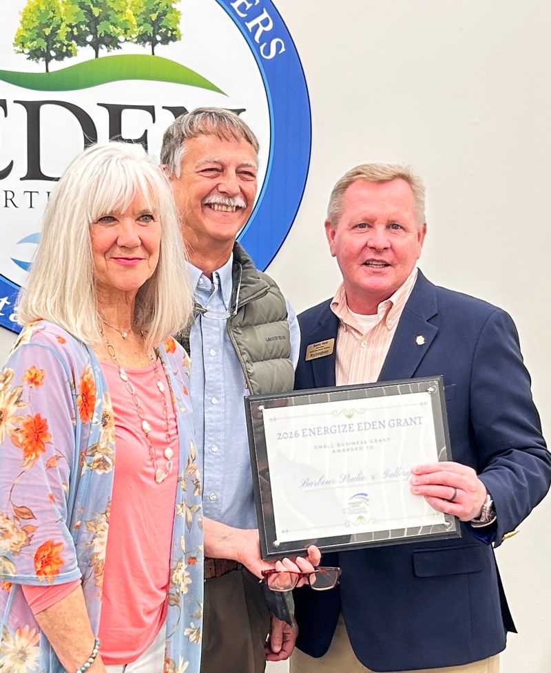 Tom and Maryann Barbour accepting their award with Randy Hunt