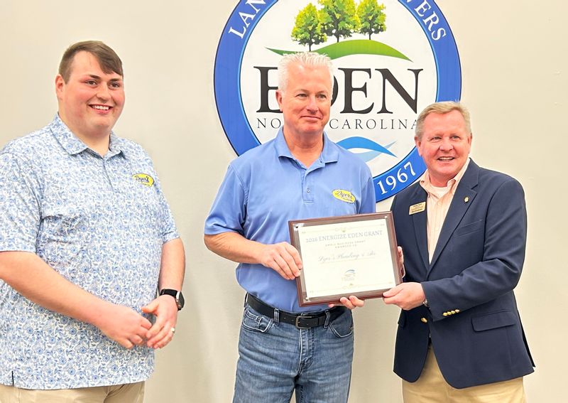 Parker Ellis and James Hubbard receiving their award with Randy Hunt.