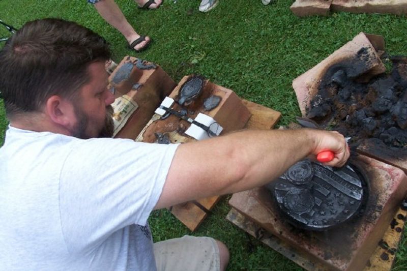 Artist Karl Unasch creating one of the sculptures for the Lanesboro Discover Sculpture Medallion Hunt