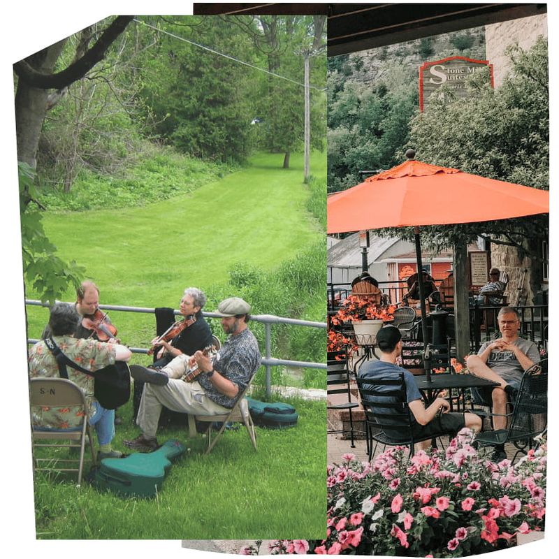 Musicians play outdoors along a grassy trail while people relax at a café patio in the Lanesboro area during spring.